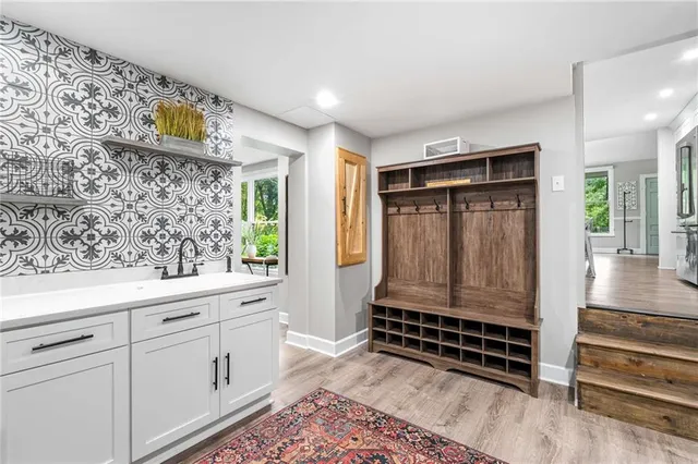 a view of a backyard with sitting area