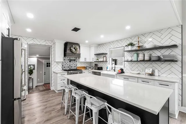 a view of a livingroom with furniture and wooden floor
