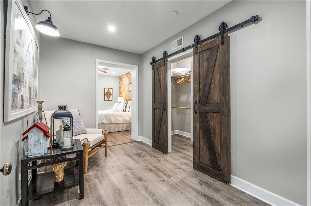 8393 Boardtown Road Ellijay, GA 30540 - Photo 22 of 54 a view of a livingroom with furniture and wooden floor