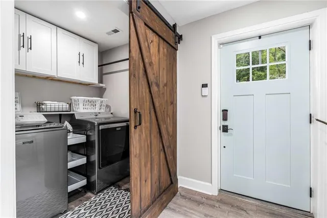 a bedroom with a bed and a large window with the outer view