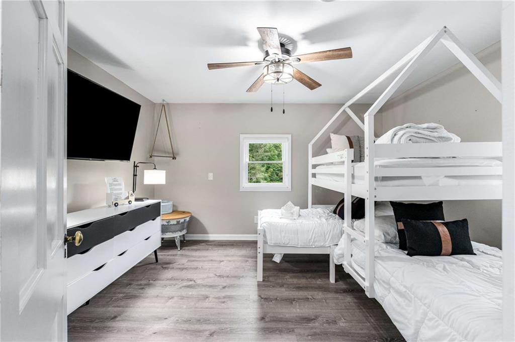 8393 Boardtown Road Ellijay, GA 30540 - Photo 31 of 54 a living room with furniture and a flat screen tv