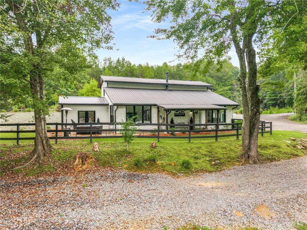 8393 Boardtown Road Ellijay, GA 30540 - Photo 38 of 54 a front view of a house with garden