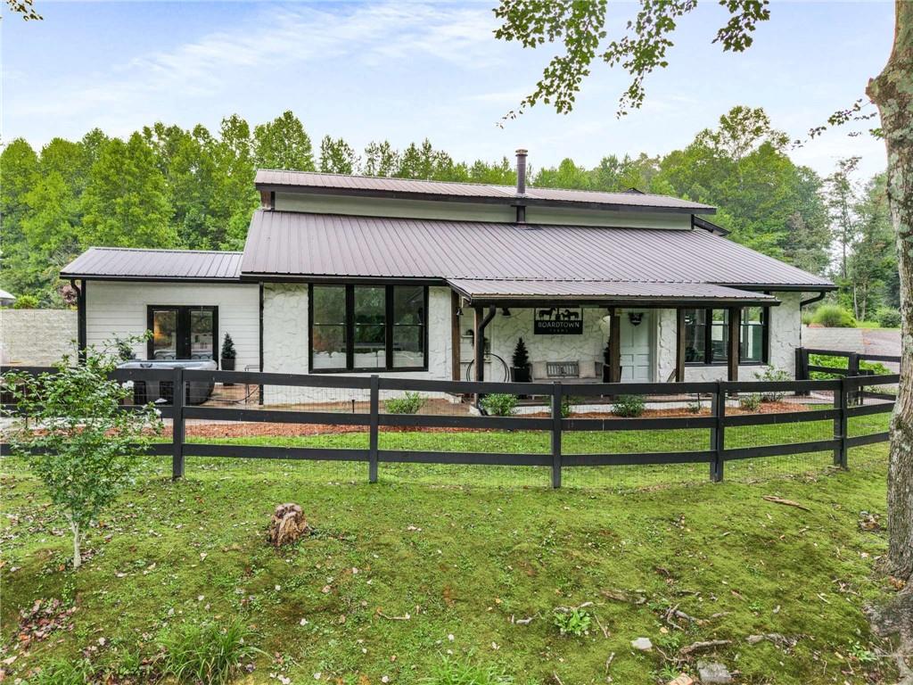 8393 Boardtown Road Ellijay, GA 30540 - Photo 39 of 54 a view of a house with pool and a yard