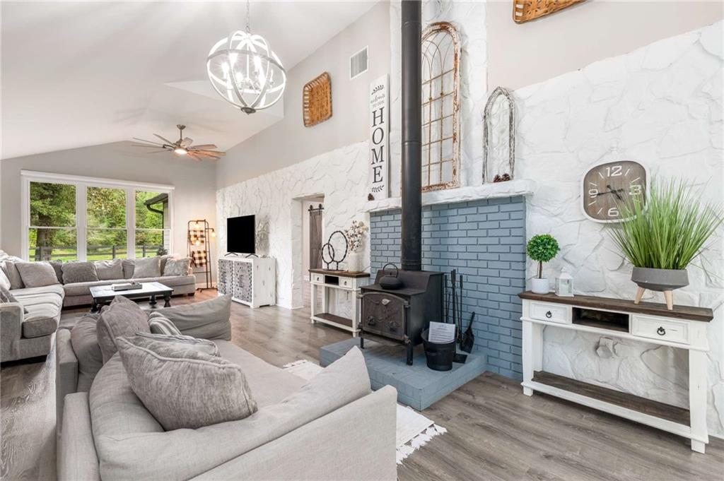 8393 Boardtown Road Ellijay, GA 30540 - Photo 4 of 54 a living room with furniture kitchen view and a large window