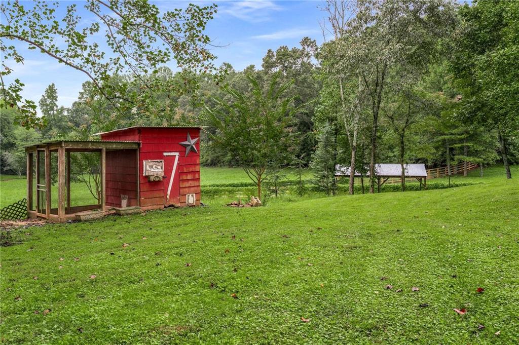 8393 Boardtown Road Ellijay, GA 30540 - Photo 41 of 54 a view of a house with a yard