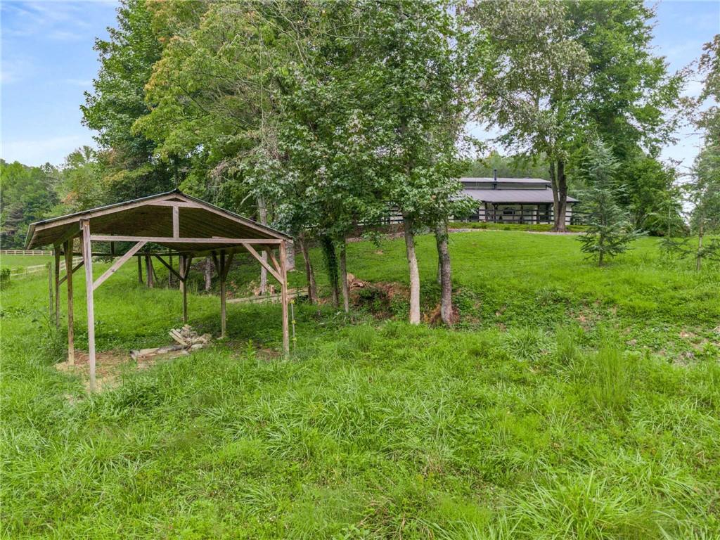 8393 Boardtown Road Ellijay, GA 30540 - Photo 43 of 54 a view of a chair and table in the garden