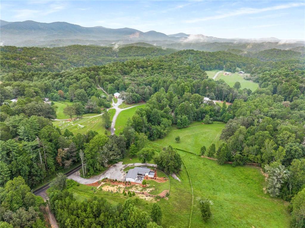 8393 Boardtown Road Ellijay, GA 30540 - Photo 52 of 54 a view of a lush green hillside and houses