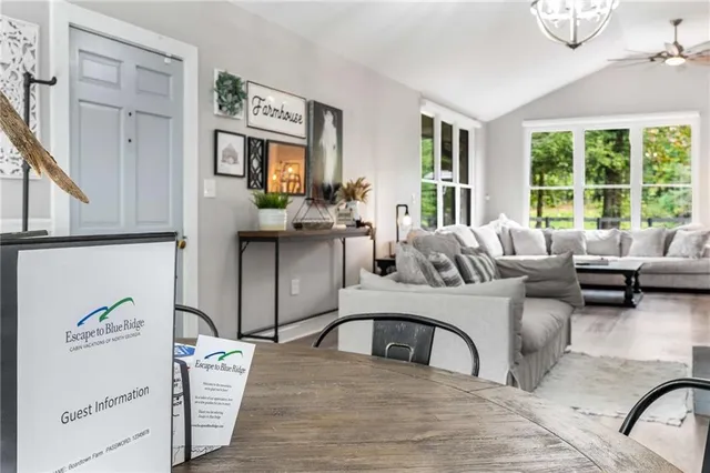a living room with furniture window and wooden floor