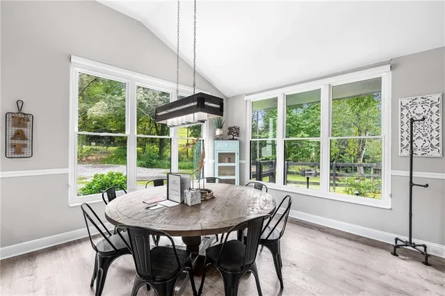 a view of a dining room with furniture window and outside view