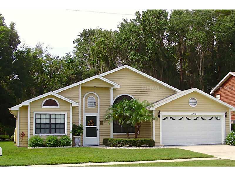 7216 Hideaway Trail New Port Richey, FL 34655 - Photo 1 of 1 a view of a house with a yard