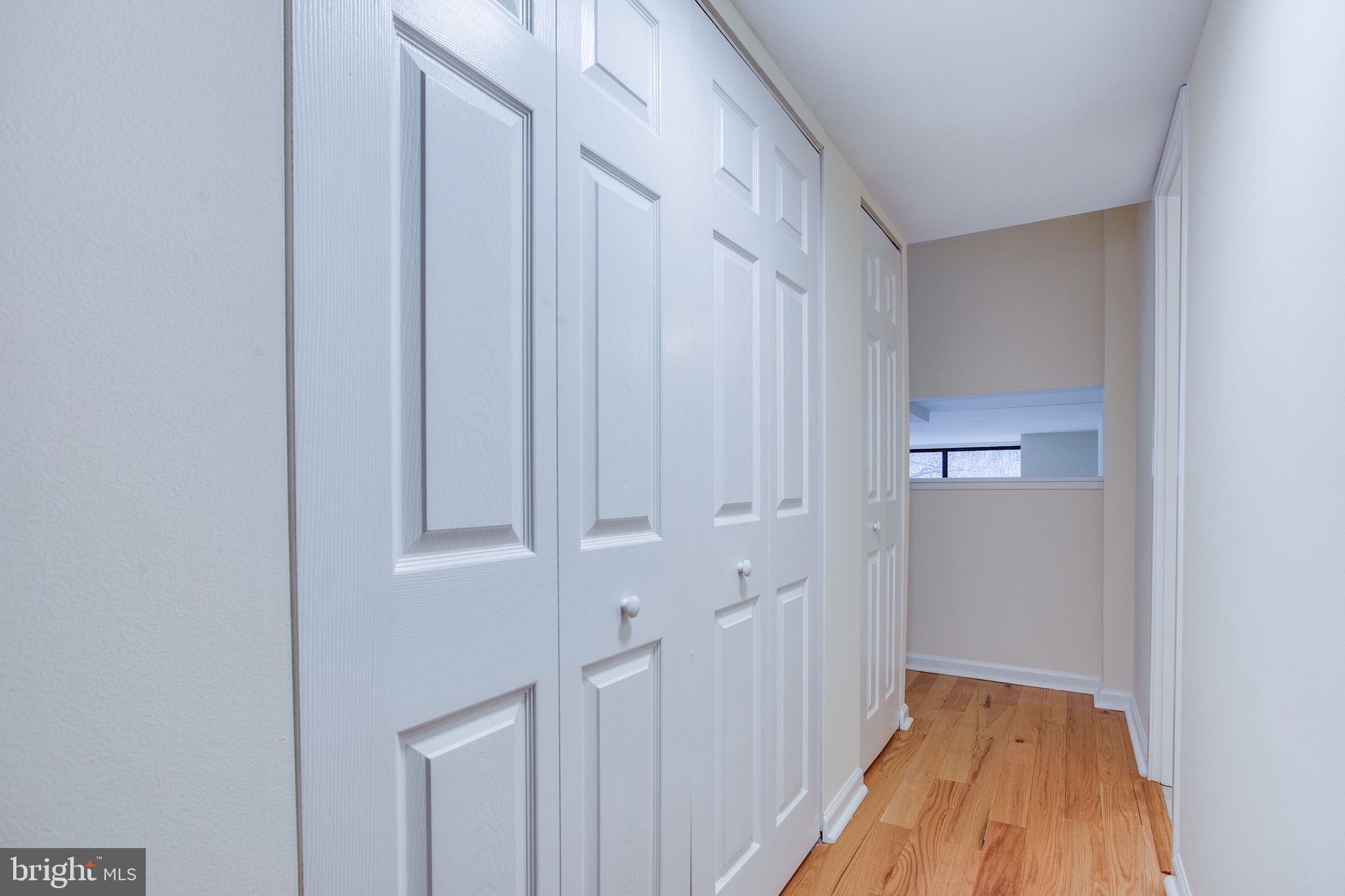 11556 Rolling Green Court, Unit 101 Reston, VA 20191 - Photo 27 of 30 Hallway towards lower level