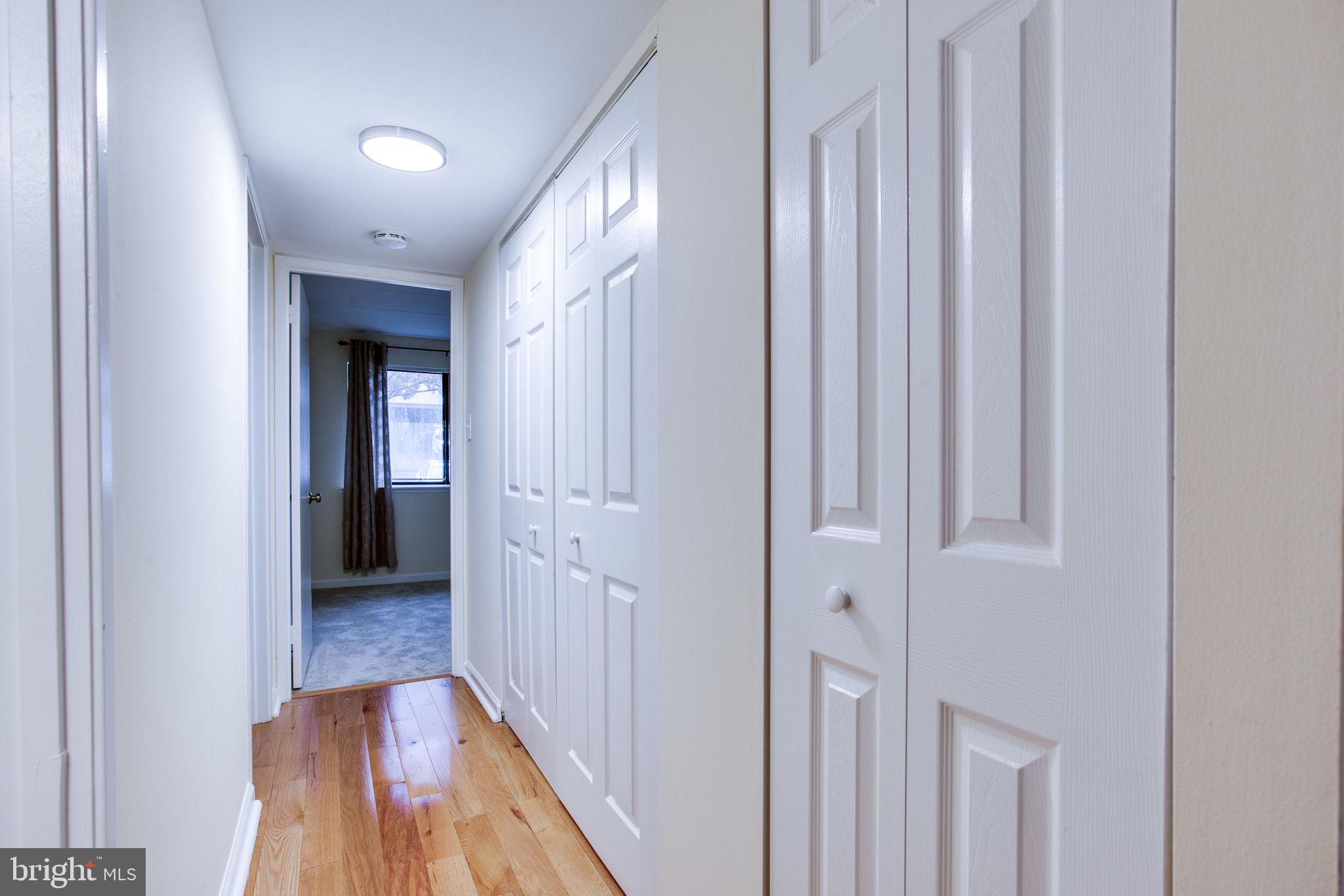 11556 Rolling Green Court, Unit 101 Reston, VA 20191 - Photo 28 of 30 Hallway towards bedroom