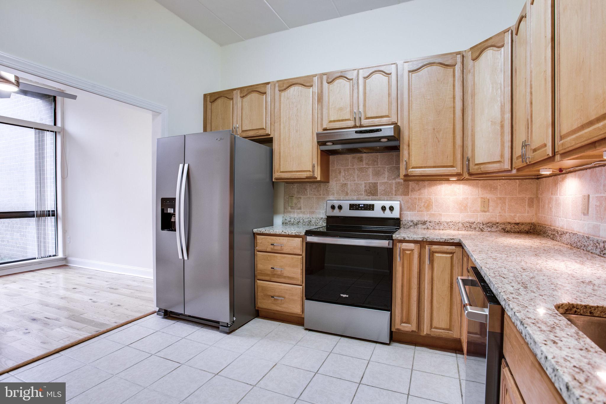 11556 Rolling Green Court, Unit 101 Reston, VA 20191 - Photo 10 of 30 Kitchen with new fridge and oven and range