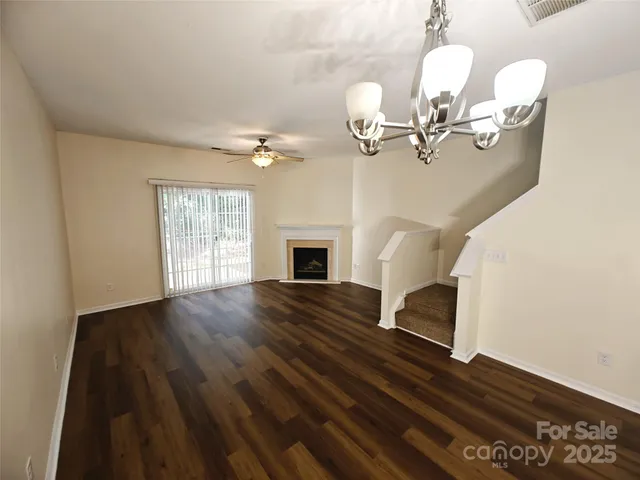 wooden floor fireplace and windows in a room