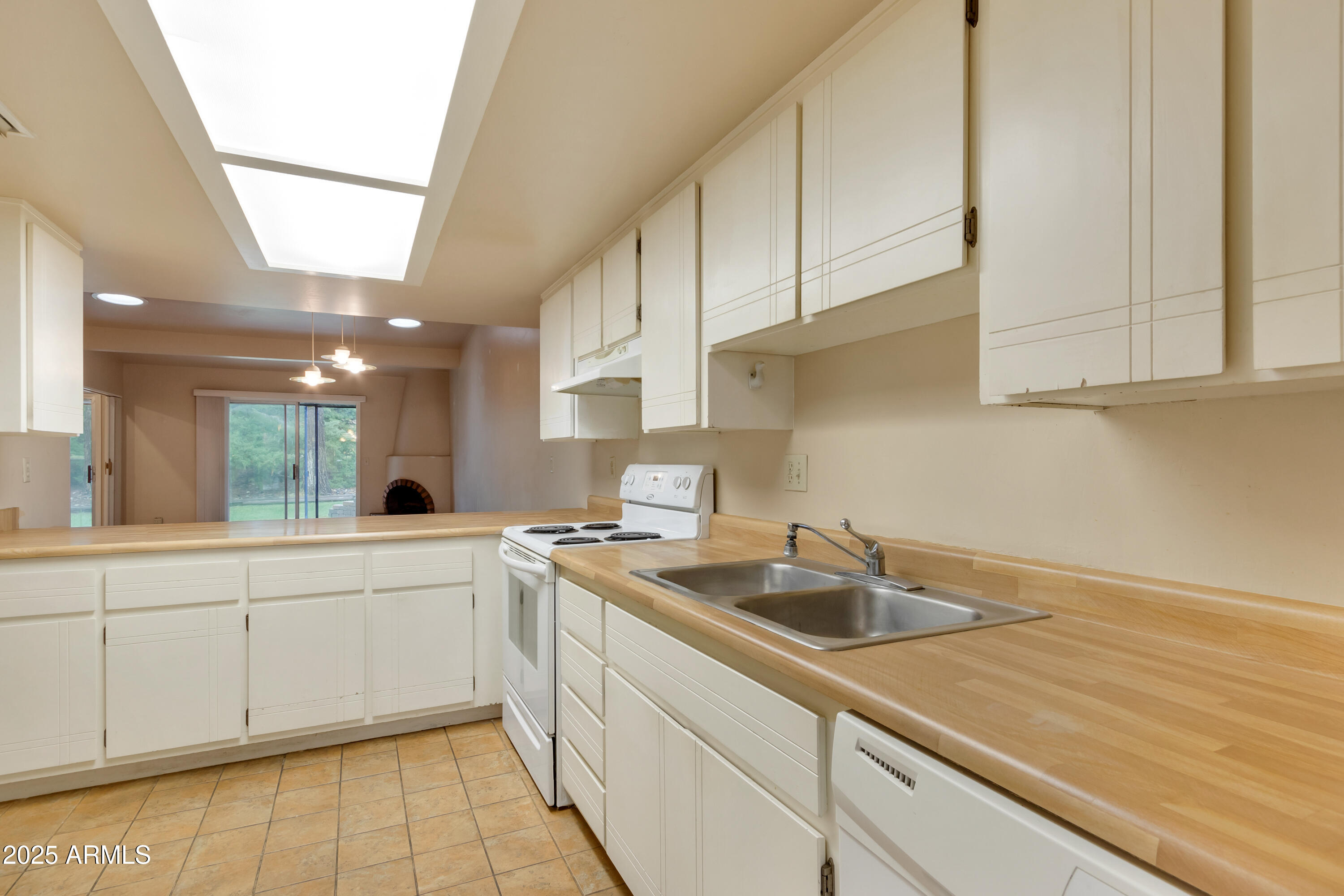 130 Castle Rock Road, Unit 45 Sedona, AZ 86351 - Photo 13 of 38 a kitchen with sink cabinets and window