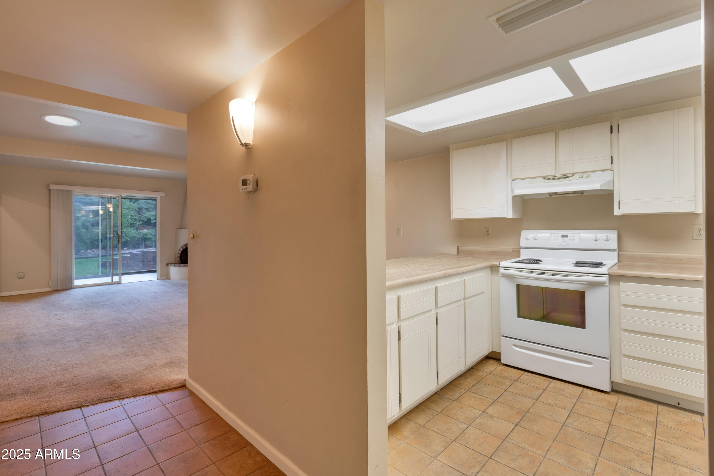 130 Castle Rock Road, Unit 45 Sedona, AZ 86351 - Photo 6 of 38 a kitchen with a stove sink and cabinets