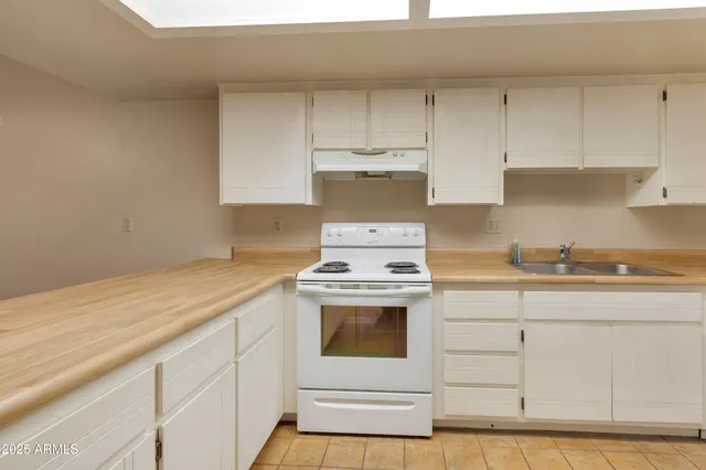 a kitchen with a stove and a sink