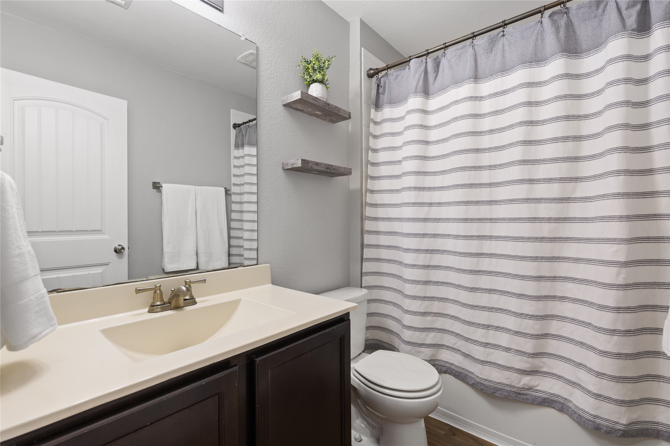 256 Alpha Kyle, TX 78640 - Photo 18 of 27 A well-appointed bathroom with a spacious vanity.