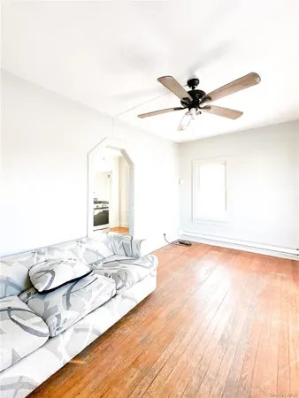 a view of a living room and chandelier