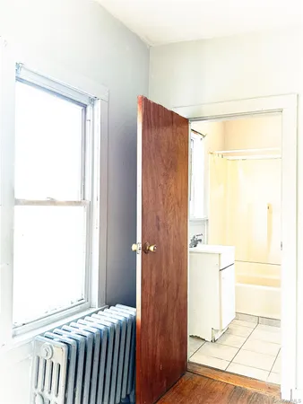 a bathroom with a glass shower door