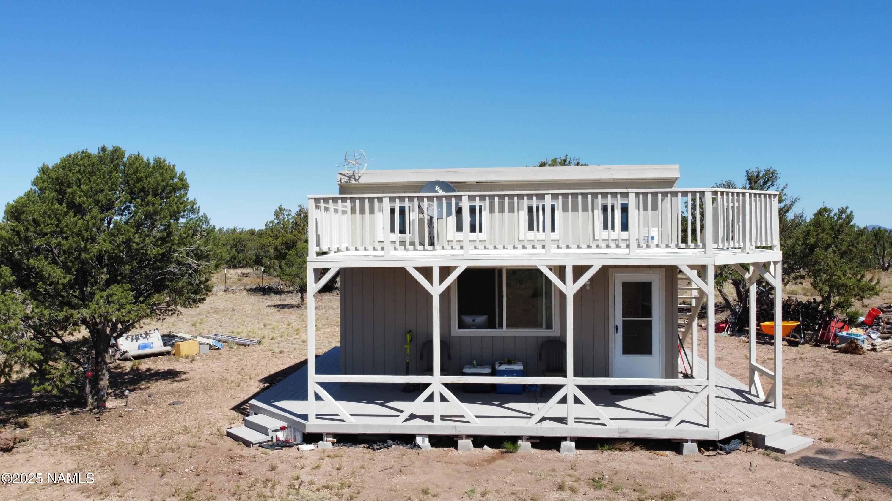 4681 Valle Road Williams, AZ 86046 - Photo 7 of 12 a front view of a house with porch