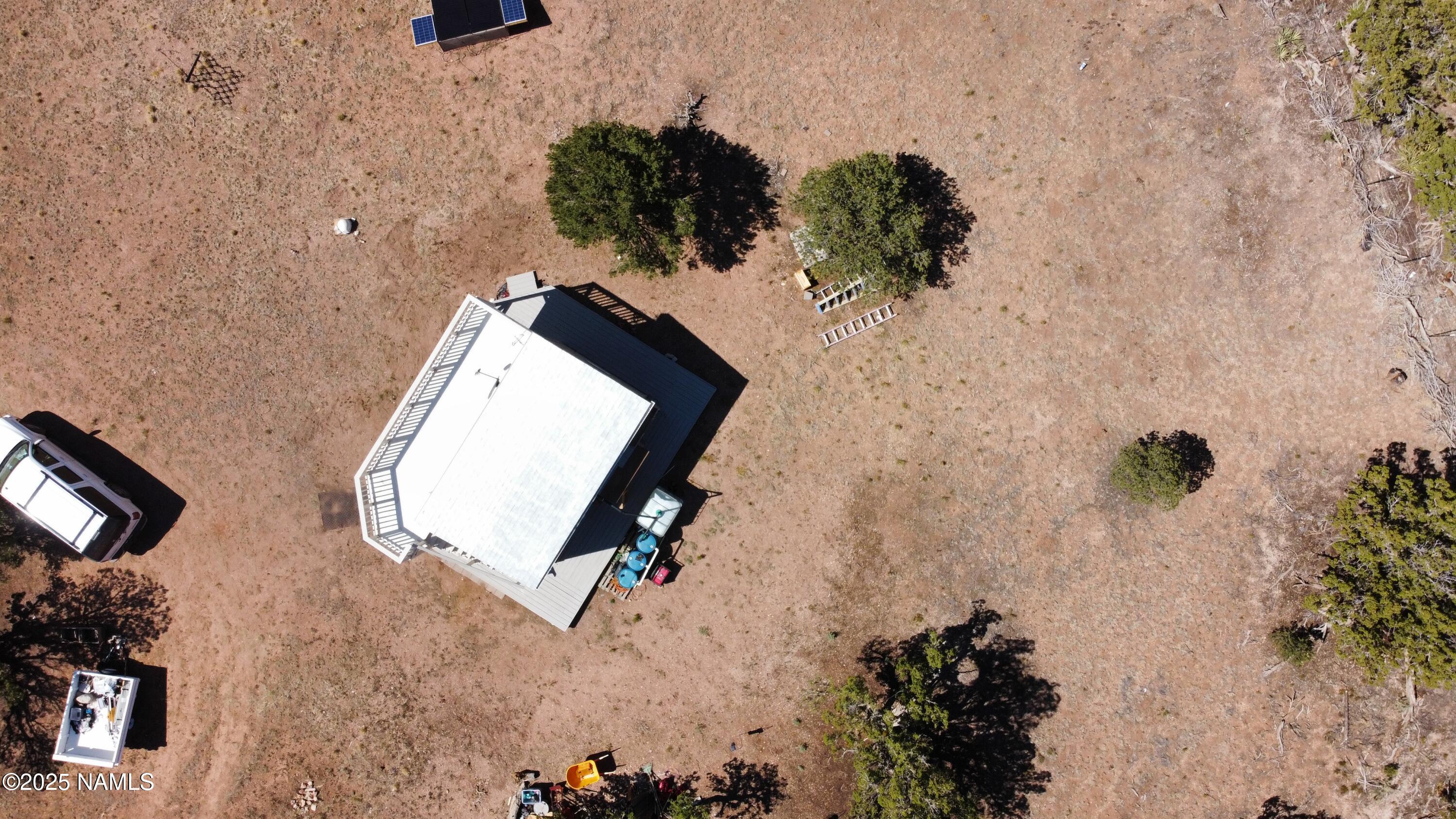 4681 Valle Road Williams, AZ 86046 - Photo 10 of 12 an aerial view of a fireplace with wooden floor