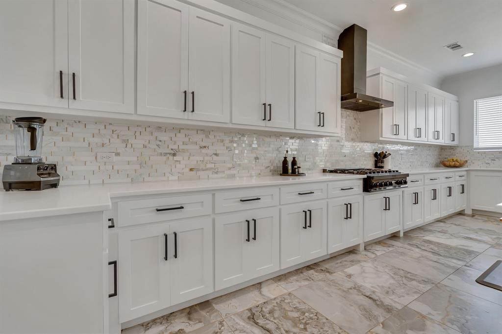 7299 Tom Trail Krum, TX 76249 - Photo 11 of 34 a kitchen with white cabinets and white appliances