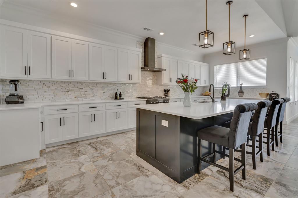 7299 Tom Trail Krum, TX 76249 - Photo 12 of 34 a kitchen with stainless steel appliances granite countertop a sink a stove and a refrigerator