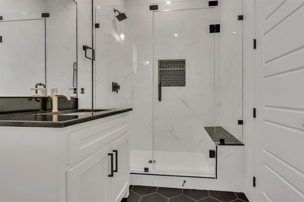 7299 Tom Trail Krum, TX 76249 - Photo 14 of 34 a bathroom with a sink and a mirror