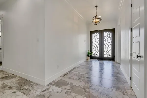 a view of an entryway with wooden floor