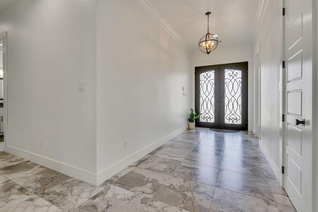 7299 Tom Trail Krum, TX 76249 - Photo 20 of 34 a view of an entryway with wooden floor