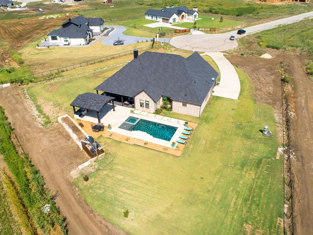 7299 Tom Trail Krum, TX 76249 - Photo 23 of 34 a view of a swimming pool with a lake view