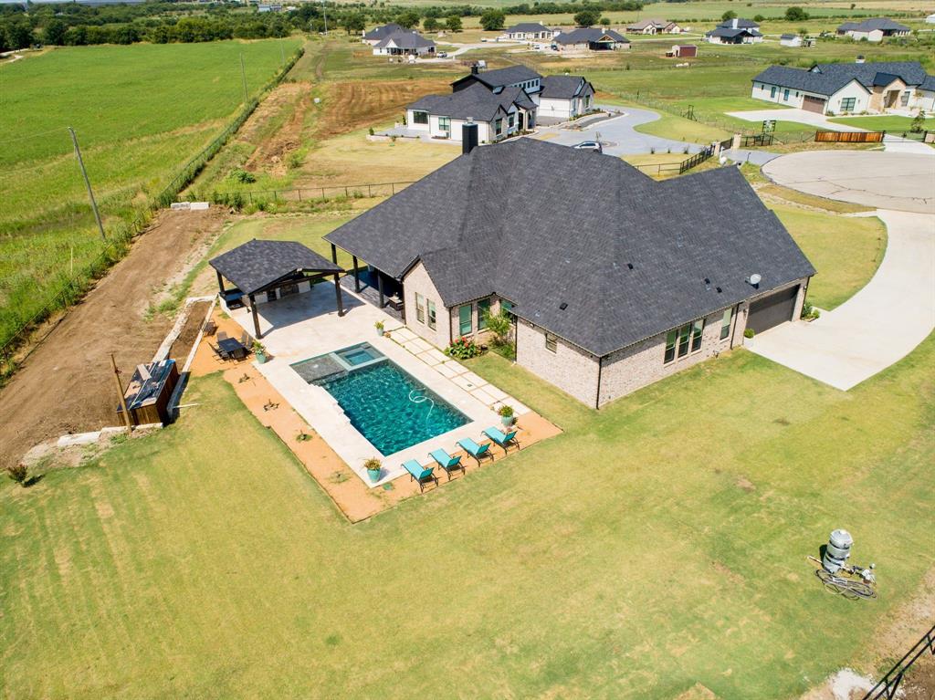 7299 Tom Trail Krum, TX 76249 - Photo 24 of 34 swimming pool view with a lake view