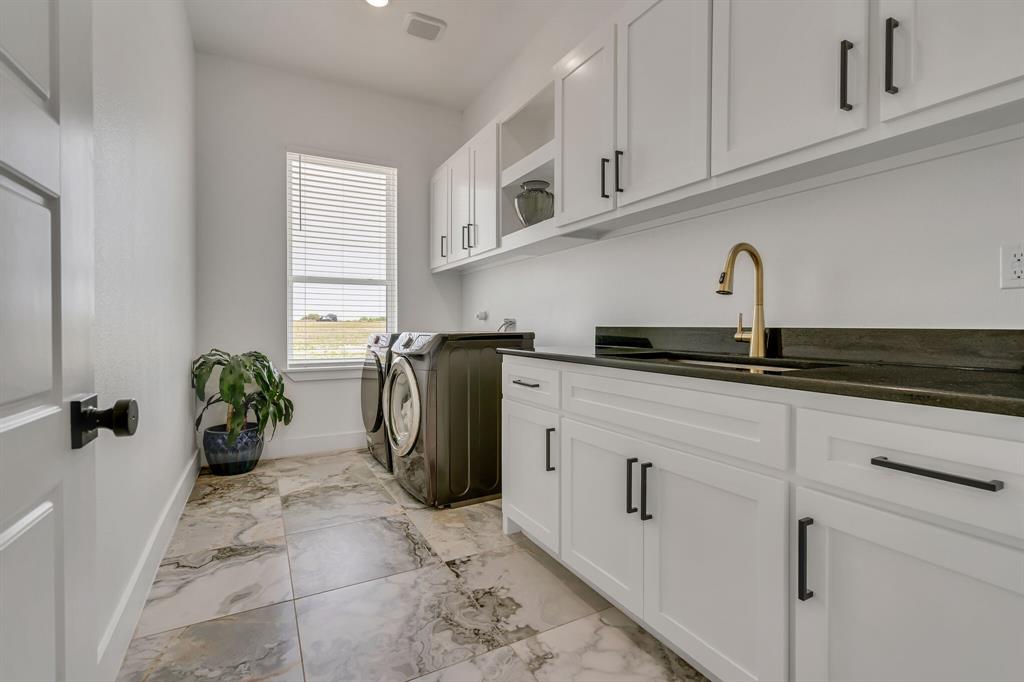 7299 Tom Trail Krum, TX 76249 - Photo 34 of 34 a kitchen with a refrigerator and cabinets