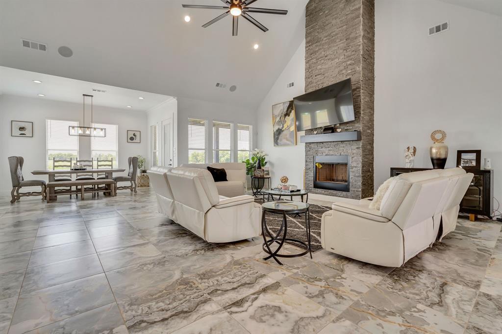 7299 Tom Trail Krum, TX 76249 - Photo 5 of 34 a living room with furniture and a fireplace