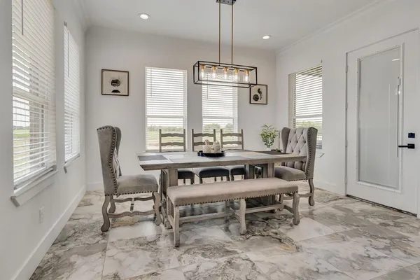 a dining room with furniture and window