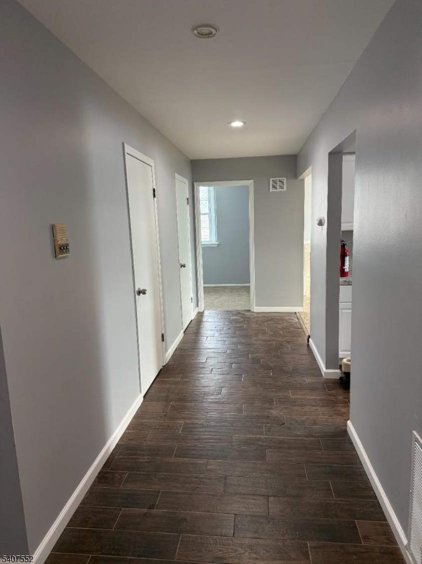 103 Park Avenue, Unit 206 Summit, NJ 07901 - Photo 15 of 25 a view of hallway with wooden floor