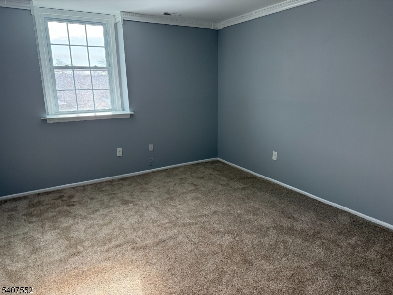 103 Park Avenue, Unit 206 Summit, NJ 07901 - Photo 20 of 25 an empty room with a window