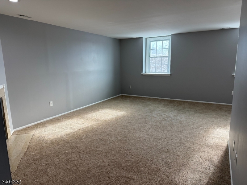 103 Park Avenue, Unit 206 Summit, NJ 07901 - Photo 4 of 25 an empty room with windows