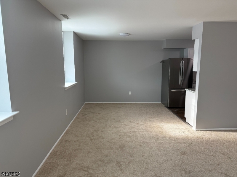 103 Park Avenue, Unit 206 Summit, NJ 07901 - Photo 6 of 25 an empty room with closet