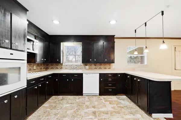 a kitchen with a sink and cabinets