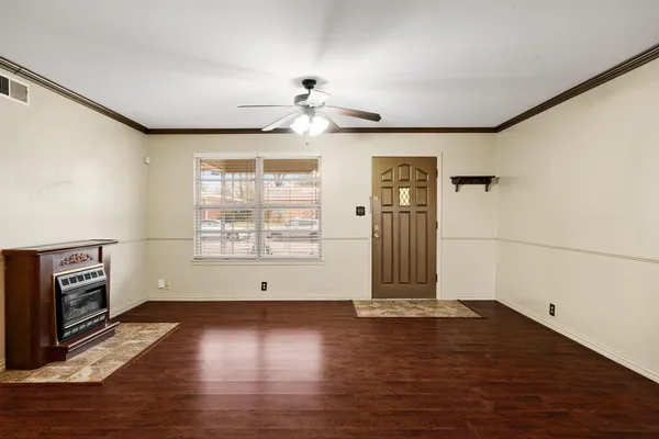 a view of livingroom with hardwood floor and a ceiling fan