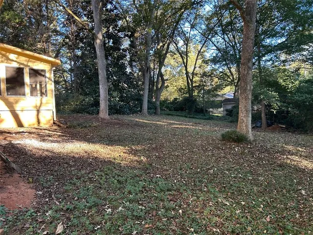 a view of a room with a black and white checkered floor
