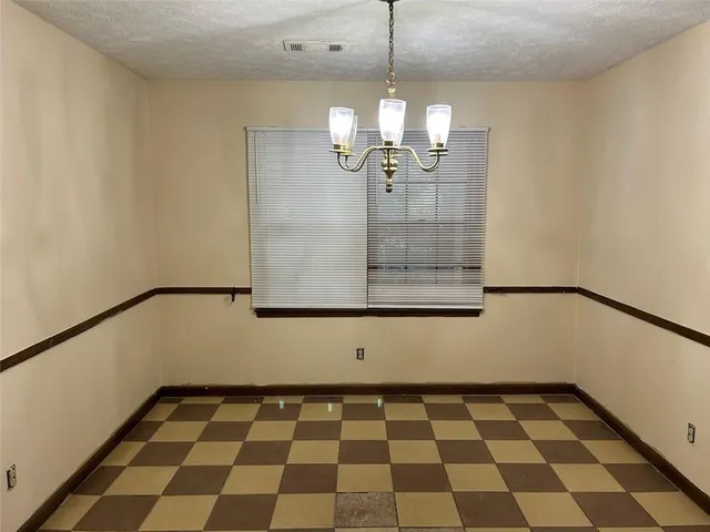 a kitchen with a sink a stove and a refrigerator