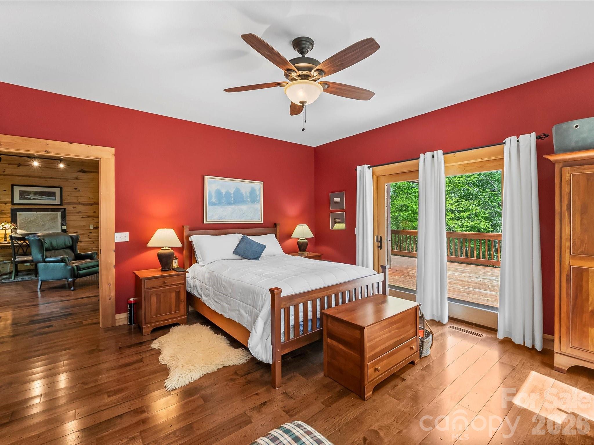 917 Otter Mountain Road Topton, NC 28781 - Photo 21 of 48 a bedroom with a bed and wooden floor