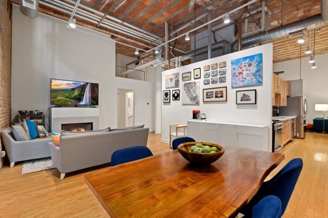 222 South Racine Avenue, Unit 207 Chicago, IL 60607 - Photo 2 of 27 a living room with furniture and a flat screen tv