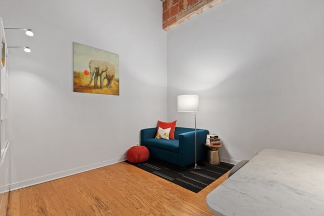 222 South Racine Avenue, Unit 207 Chicago, IL 60607 - Photo 22 of 27 a bed room with a bed and a couch