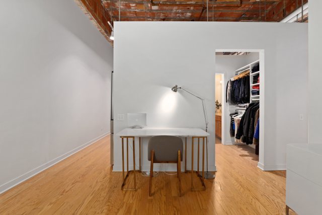 222 South Racine Avenue, Unit 207 Chicago, IL 60607 - Photo 23 of 27 a view of a livingroom with furniture and a ceiling fan