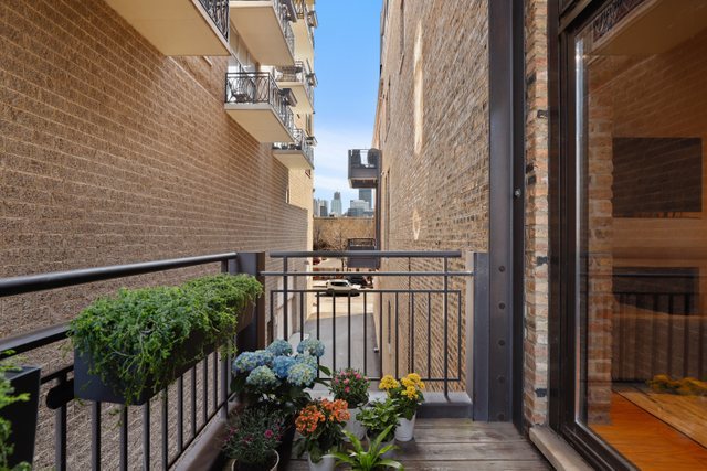 222 South Racine Avenue, Unit 207 Chicago, IL 60607 - Photo 10 of 27 a view of a house with a flower garden