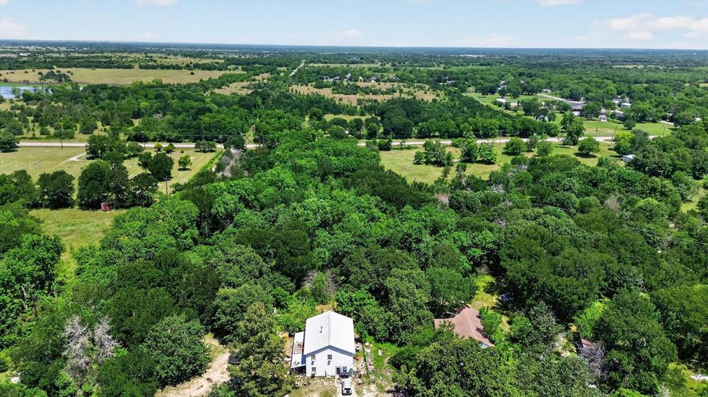 613 Main Street Quinlan, TX 75474 - Photo 5 of 16 Acreage featuring dense tree cover and open fields